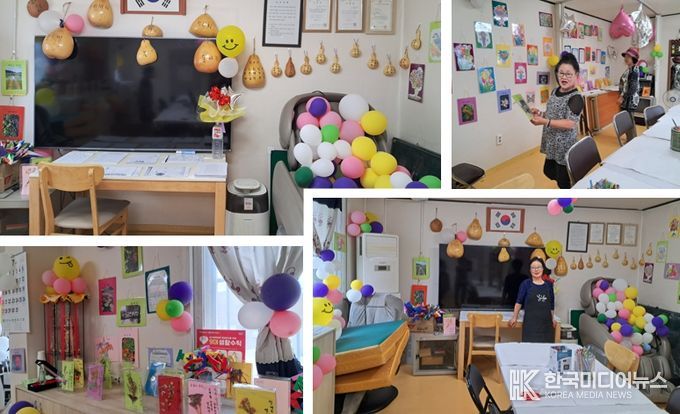 오포읍 문형3통 되치미마을 노인회 그림대회에 전시된 작품을 감상하는 어르신들의 모습